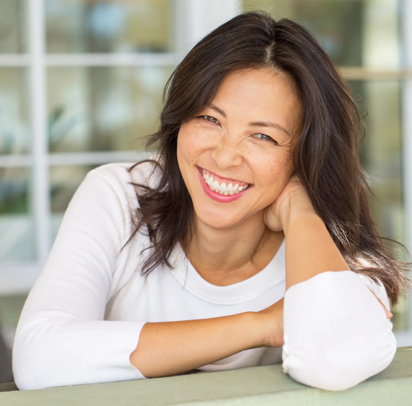 Portrait of an Asian woman smiling. Juvederm® Ultra XC and Juvederm® Ultra Plus XC in Indianapolis, Indiana
